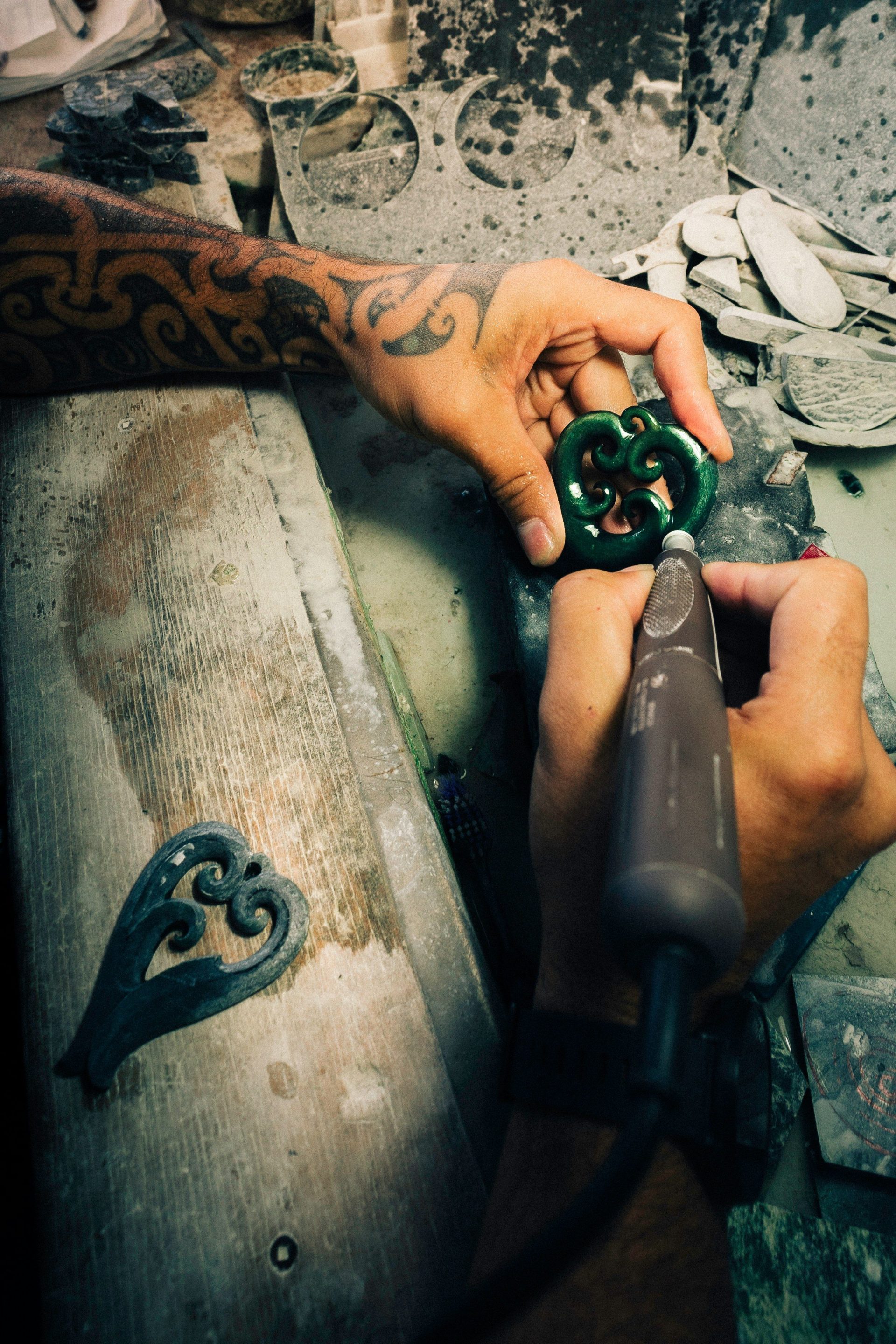 A man is working on a piece of metal