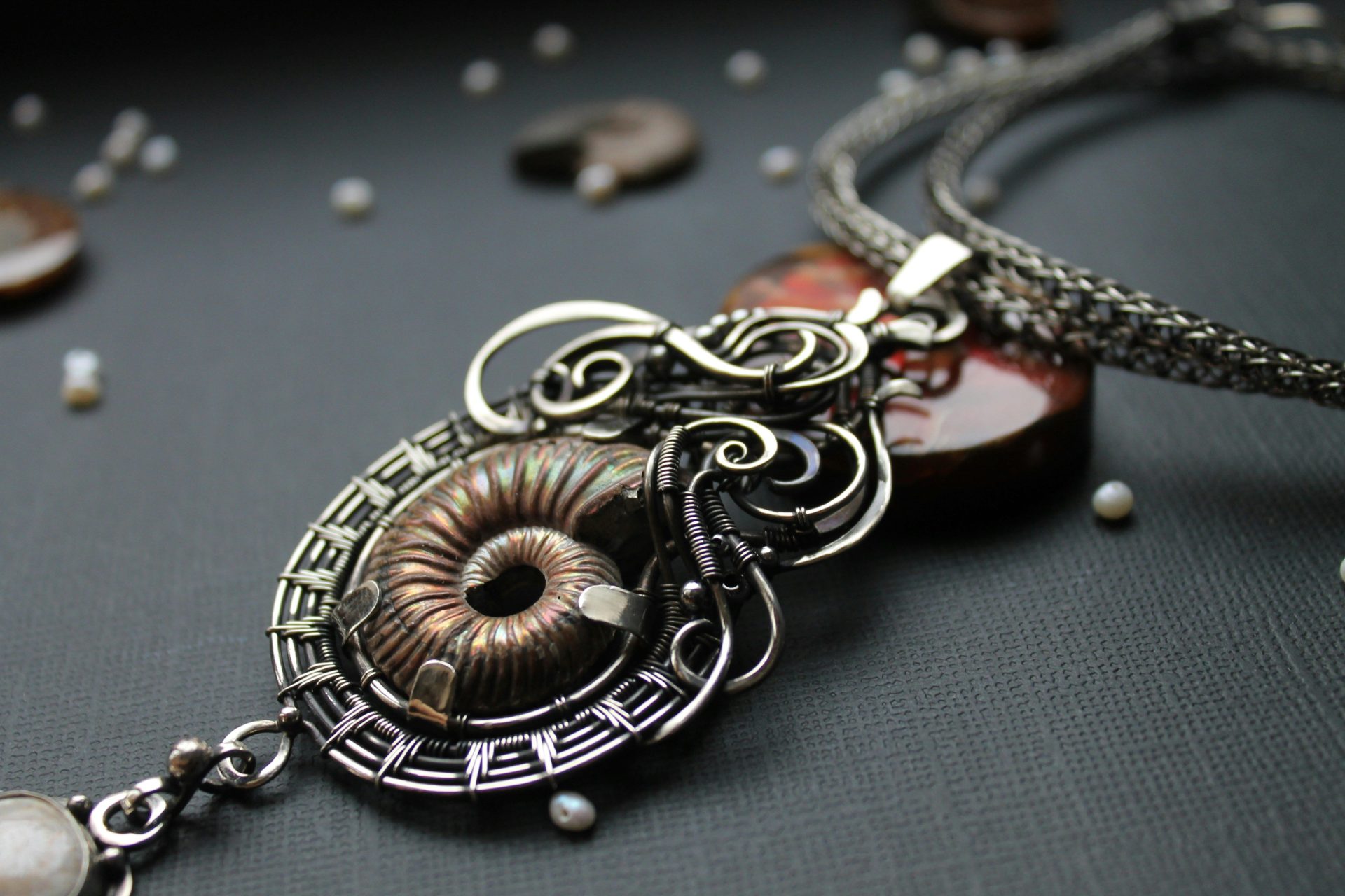 a close up of a necklace on a table