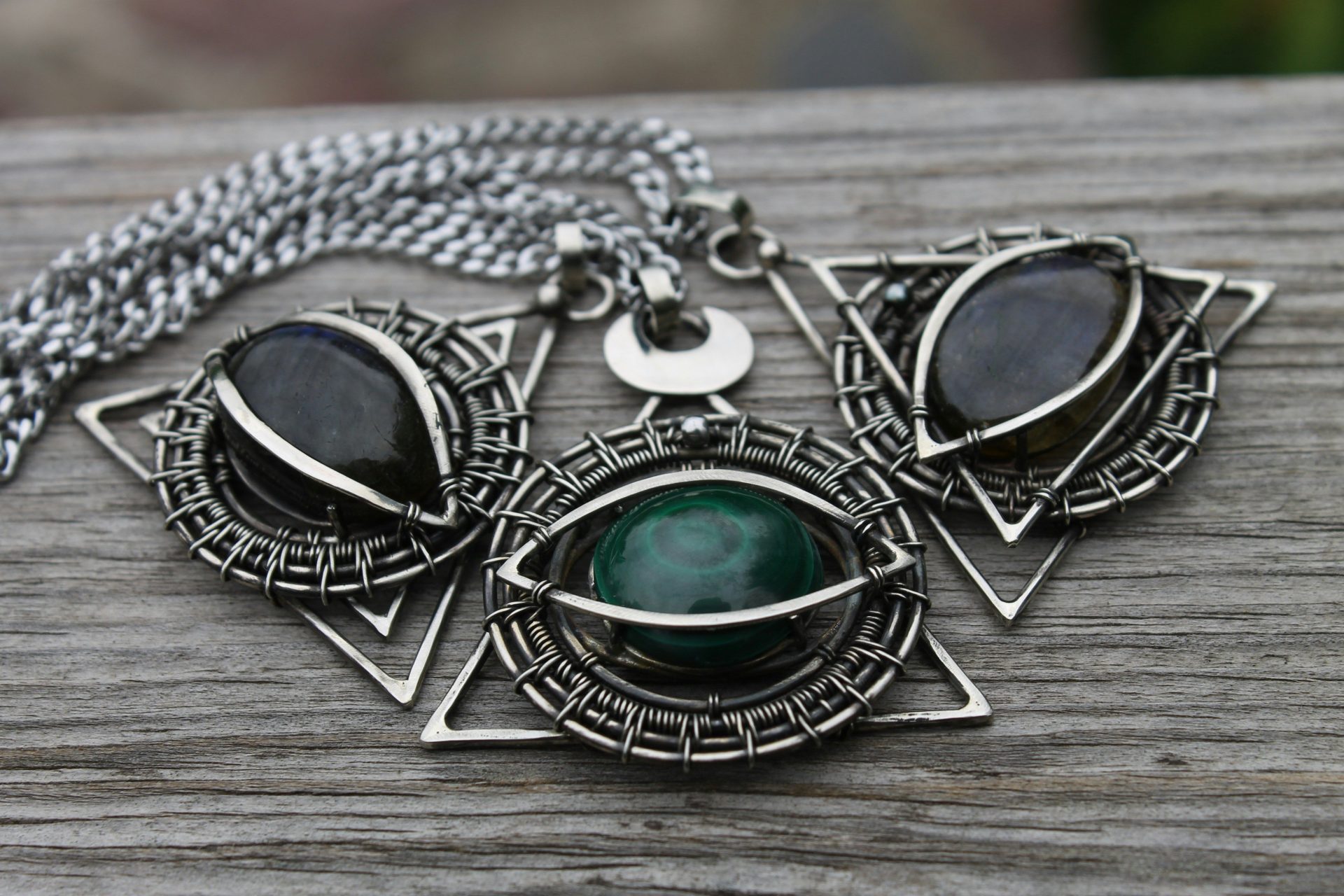A close up of a necklace on a wooden surface